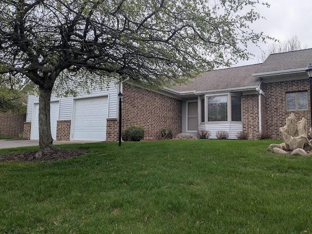 2645 Falcon Point Dr NW, Grand Rapids, MI 49534 - single story home with brick siding, a front yard, driveway, and roof with shingles