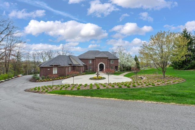 5001 Forest Vly, Clarkston, MI 48348 - view of front of property with a front lawn, brick siding, and curved driveway