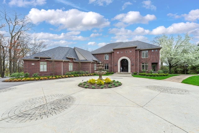 5001 Forest Vly, Clarkston, MI 48348 - view of front facade featuring curved driveway and brick siding