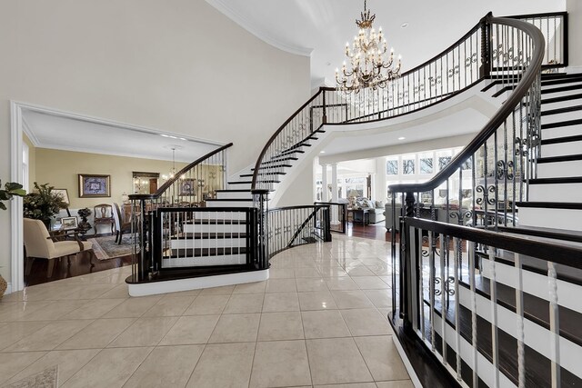 5001 Forest Vly, Clarkston, MI 48348 - entrance foyer featuring stairs, ornamental molding, a chandelier, tile patterned floors, and a high ceiling