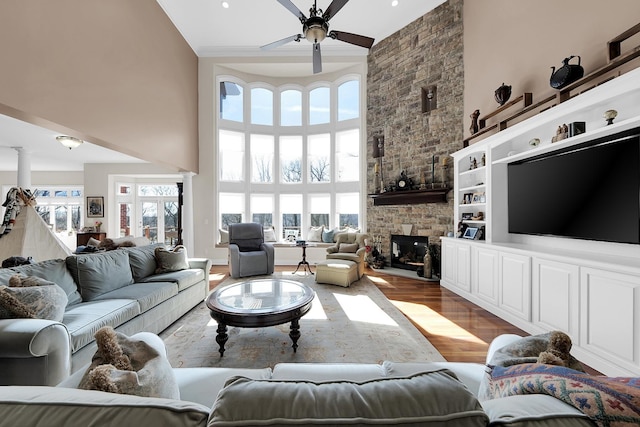 5001 Forest Vly, Clarkston, MI 48348 - living area featuring a high ceiling, ceiling fan, plenty of natural light, light wood-type flooring, and decorative columns