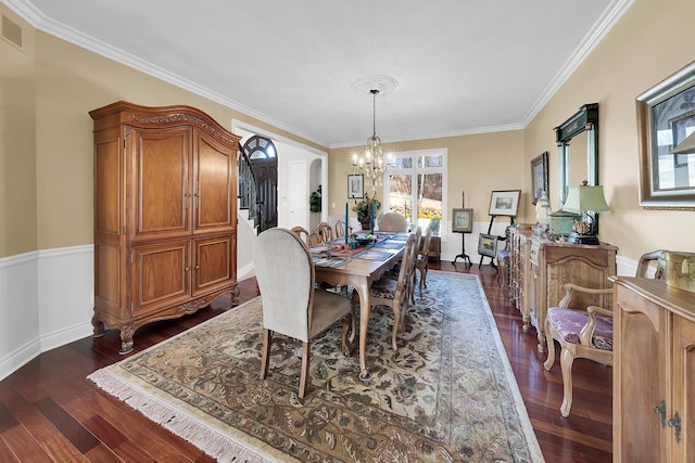 5001 Forest Vly, Clarkston, MI 48348 - dining area with a chandelier, arched walkways, dark wood-type flooring, ornamental molding, and baseboards