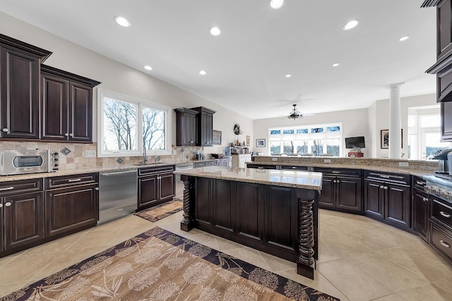5001 Forest Vly, Clarkston, MI 48348 - kitchen featuring dishwasher, a sink, ceiling fan, a kitchen island, and decorative backsplash