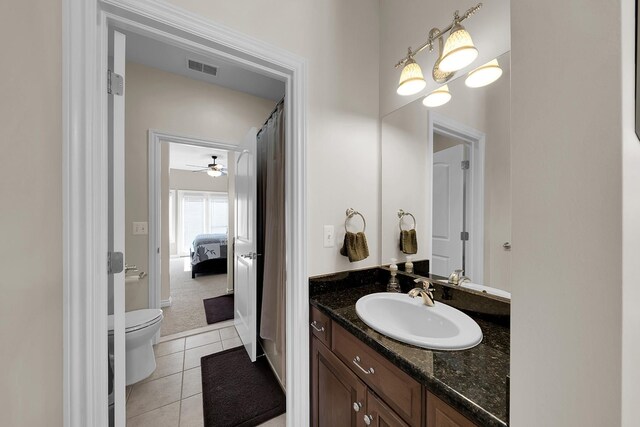 5001 Forest Vly, Clarkston, MI 48348 - bathroom featuring vanity, toilet, tile patterned floors, a ceiling fan, and connected bathroom