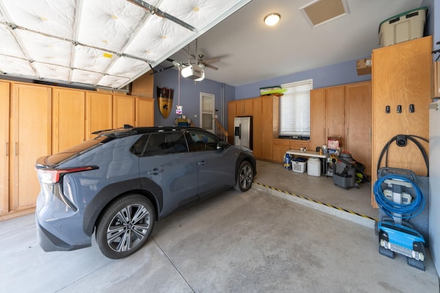 5001 Forest Vly, Clarkston, MI 48348 - garage featuring a garage door opener and a ceiling fan