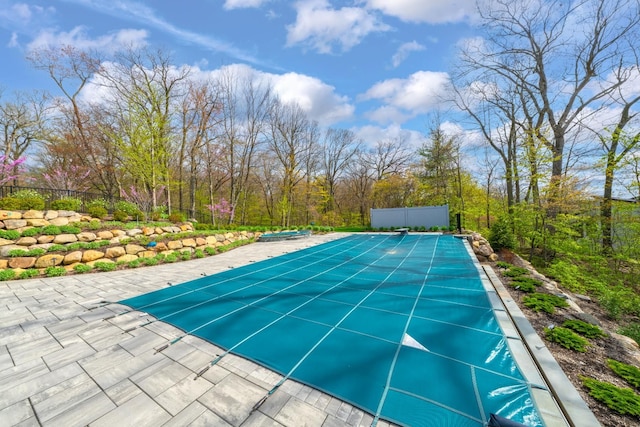 5001 Forest Vly, Clarkston, MI 48348 - view of pool featuring a covered pool, fence, a diving board, and a patio area