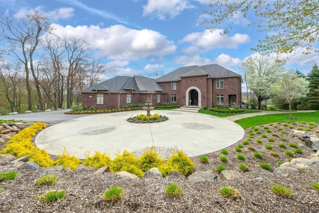 5001 Forest Vly, Clarkston, MI 48348 - colonial-style house with curved driveway and brick siding