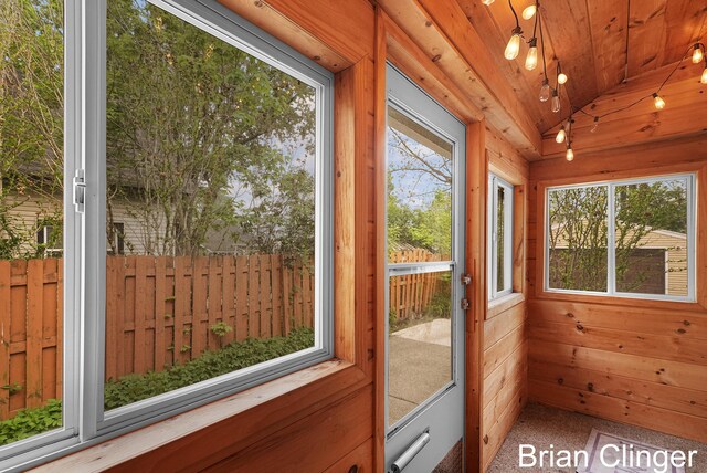 117 Palmer St NE, Grand Rapids, MI 49505 - unfurnished sunroom featuring lofted ceiling, wood ceiling, and wood walls