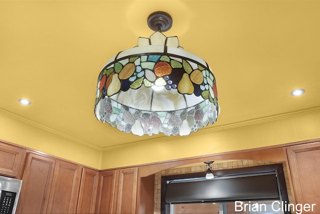 117 Palmer St NE, Grand Rapids, MI 49505 - kitchen view of brown cabinetry and crown molding