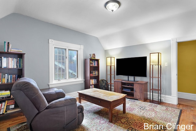 117 Palmer St NE, Grand Rapids, MI 49505 - living room with vaulted ceiling, hardwood / wood-style floors, and baseboards