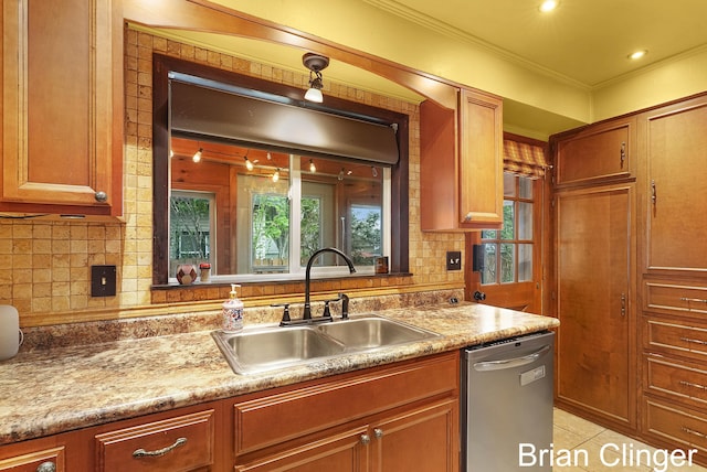 117 Palmer St NE, Grand Rapids, MI 49505 - kitchen featuring a sink, stainless steel dishwasher, backsplash, ornamental molding, and light countertops