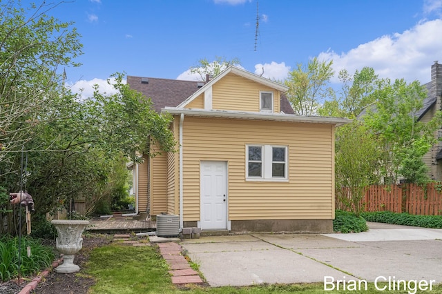 117 Palmer St NE, Grand Rapids, MI 49505 - back of property featuring fence, a patio area, and cooling unit