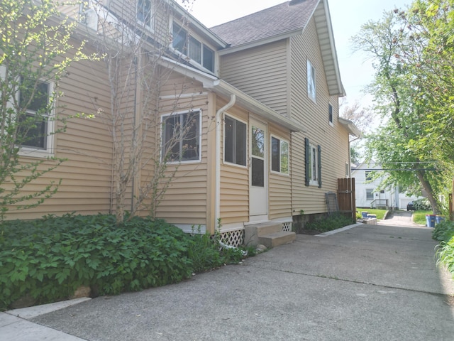 117 Palmer St NE, Grand Rapids, MI 49505 - view of home's exterior featuring roof with shingles