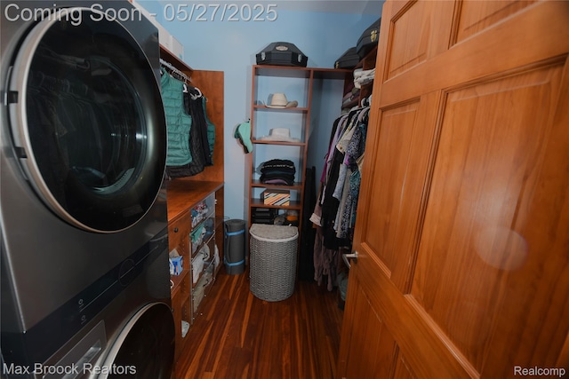 58282 Savage Rd, Vandalia, MI 49095 - washroom featuring stacked washing machine and dryer and wood finished floors