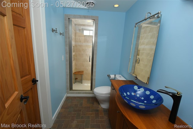 58282 Savage Rd, Vandalia, MI 49095 - full bathroom with a shower stall, baseboards, toilet, and vanity