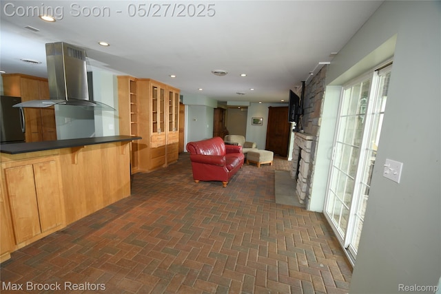 58282 Savage Rd, Vandalia, MI 49095 - living area featuring brick patterned flooring, a fireplace, and recessed lighting