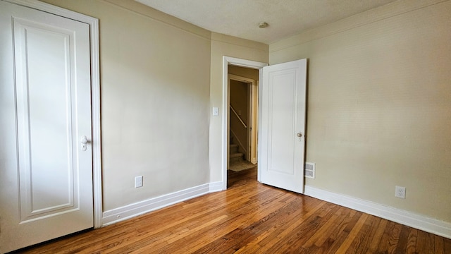 5790 Lakepointe St, Detroit, MI 48224 - unfurnished bedroom featuring wood finished floors and baseboards