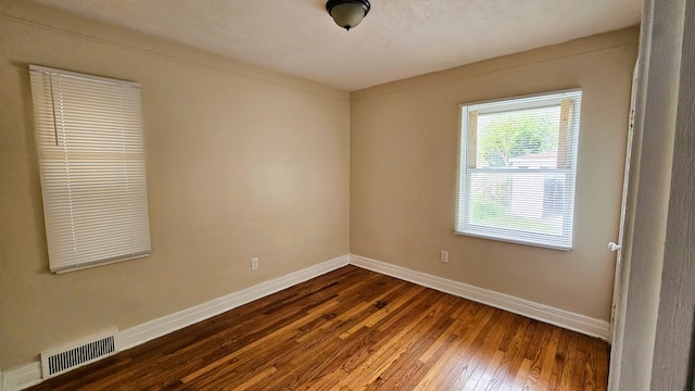 5790 Lakepointe St, Detroit, MI 48224 - spare room with baseboards and dark wood-style floors