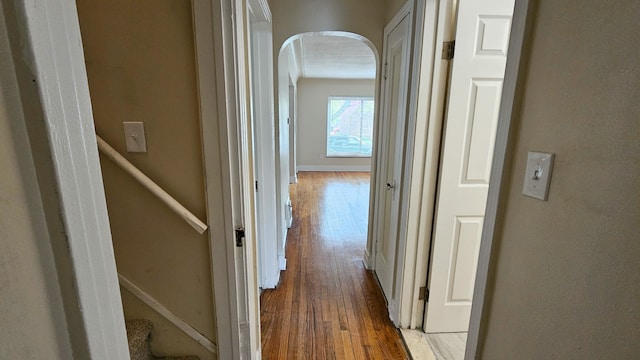 5790 Lakepointe St, Detroit, MI 48224 - hall with light wood finished floors, arched walkways, and baseboards