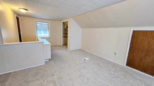 5790 Lakepointe St, Detroit, MI 48224 - additional living space with carpet flooring, wood walls, and vaulted ceiling