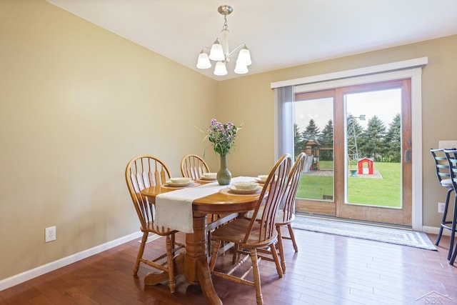6115 N Belsay Rd, Flint, MI 48506 - dining space featuring a chandelier, baseboards, and hardwood / wood-style floors
