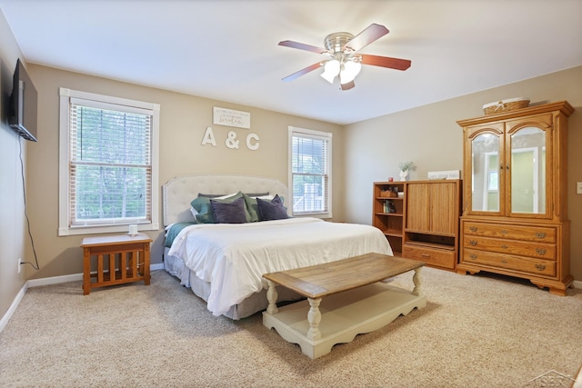6115 N Belsay Rd, Flint, MI 48506 - bedroom featuring light carpet, baseboards, and ceiling fan