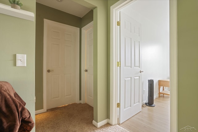 6115 N Belsay Rd, Flint, MI 48506 - corridor featuring baseboards and light carpet