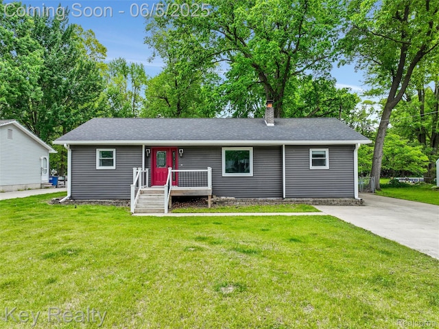 37627 Marquette St, Westland, MI 48185 - view of front facade featuring a front lawn, a chimney, and roof with shingles