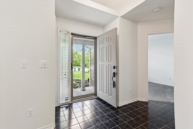 5496 Michael Dr, Ypsilanti, MI 48197 - entryway featuring baseboards and dark tile patterned floors