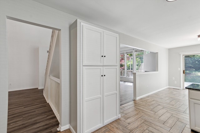 5496 Michael Dr, Ypsilanti, MI 48197 - hallway featuring baseboards and parquet flooring