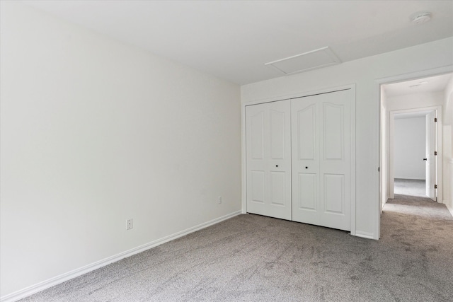 5496 Michael Dr, Ypsilanti, MI 48197 - unfurnished bedroom featuring carpet flooring, a closet, attic access, and baseboards
