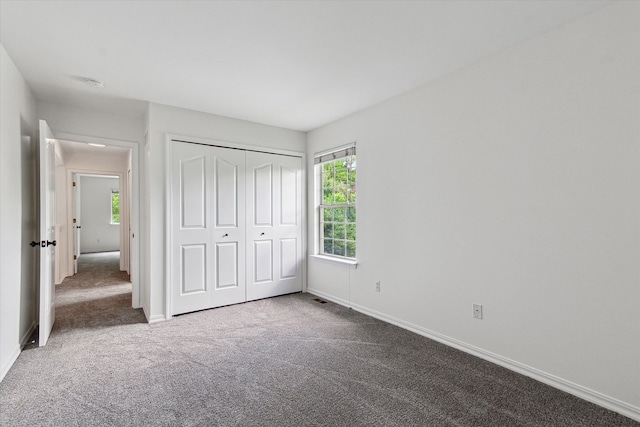 5496 Michael Dr, Ypsilanti, MI 48197 - unfurnished bedroom with carpet flooring, baseboards, and a closet
