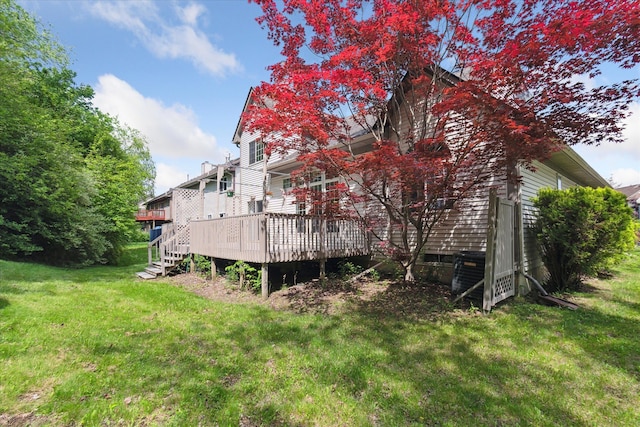 5496 Michael Dr, Ypsilanti, MI 48197 - view of property exterior with a deck, a lawn, and central AC
