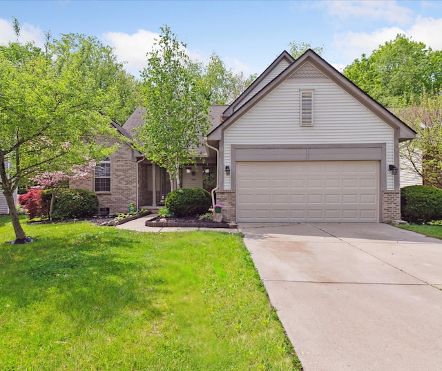 5496 Michael Dr, Ypsilanti, MI 48197 - view of front of home with brick siding, a front yard, driveway, and an attached garage