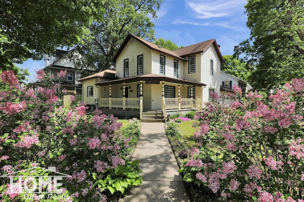 102 E Second St, Morrice, MI 48857 - view of front facade with a porch
