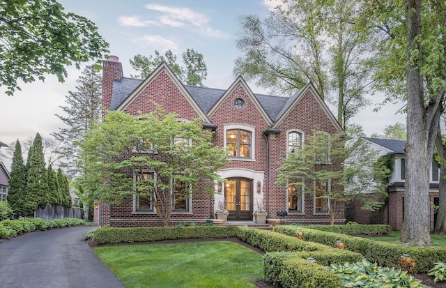 316 Chesterfield Ave, Birmingham, MI 48009 - view of front of home with french doors, brick siding, and a chimney