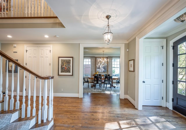 316 Chesterfield Ave, Birmingham, MI 48009 - foyer featuring a chandelier, wood finished floors, baseboards, ornamental molding, and stairway