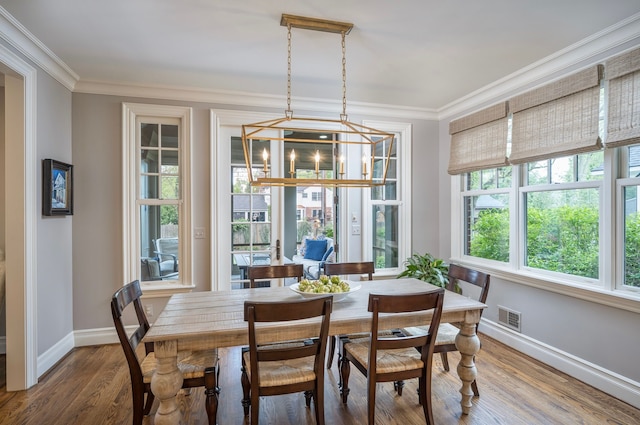 316 Chesterfield Ave, Birmingham, MI 48009 - dining area featuring ornamental molding, baseboards, and wood finished floors
