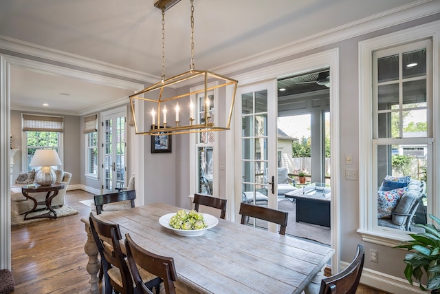 316 Chesterfield Ave, Birmingham, MI 48009 - dining room with wood finished floors, french doors, ornamental molding, a chandelier, and baseboards