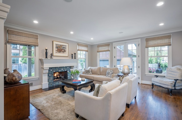 316 Chesterfield Ave, Birmingham, MI 48009 - living area with a tile fireplace, crown molding, baseboards, wood finished floors, and recessed lighting