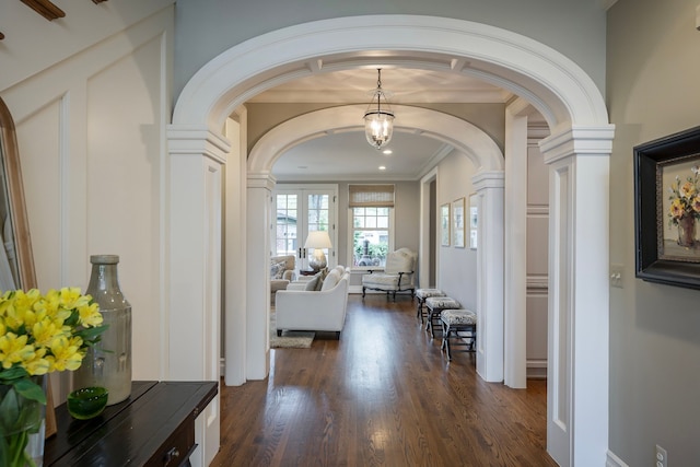 316 Chesterfield Ave, Birmingham, MI 48009 - corridor with arched walkways, decorative columns, dark wood-style flooring, ornamental molding, and baseboards