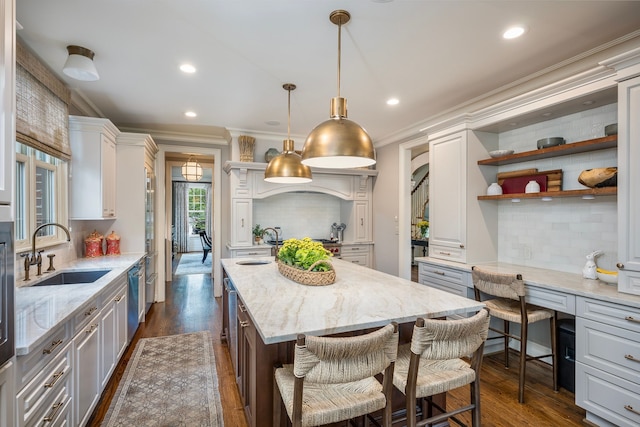 316 Chesterfield Ave, Birmingham, MI 48009 - kitchen with a sink, crown molding, tasteful backsplash, recessed lighting, and a kitchen island with sink