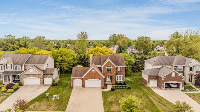 57677 Blossom Valley Trl, New Hudson, MI 48165 - aerial view of residential area featuring a tree filled landscape