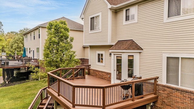 57677 Blossom Valley Trl, New Hudson, MI 48165 - wooden terrace featuring a yard