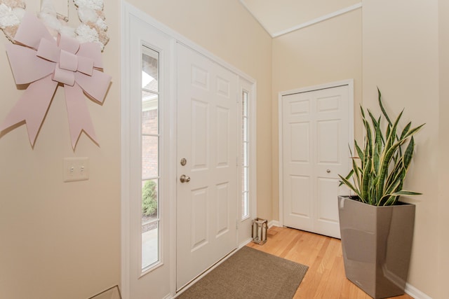 57677 Blossom Valley Trl, New Hudson, MI 48165 - foyer with light wood-type flooring and baseboards