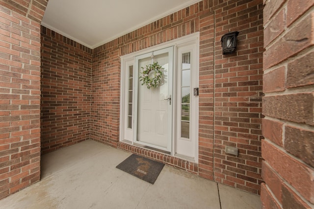 57677 Blossom Valley Trl, New Hudson, MI 48165 - doorway to property with brick siding