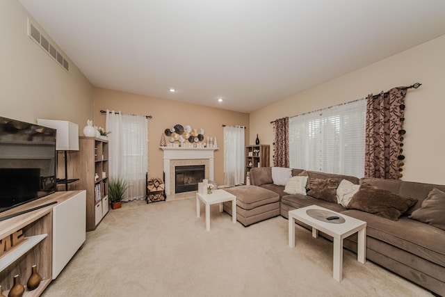 57677 Blossom Valley Trl, New Hudson, MI 48165 - living area with a fireplace, light carpet, and recessed lighting