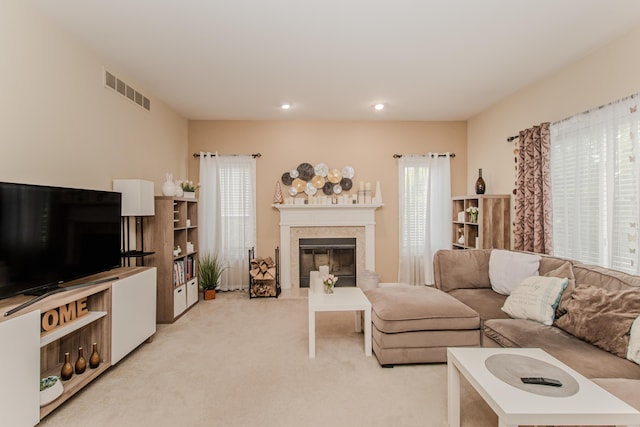 57677 Blossom Valley Trl, New Hudson, MI 48165 - living room featuring light colored carpet, a glass covered fireplace, and recessed lighting