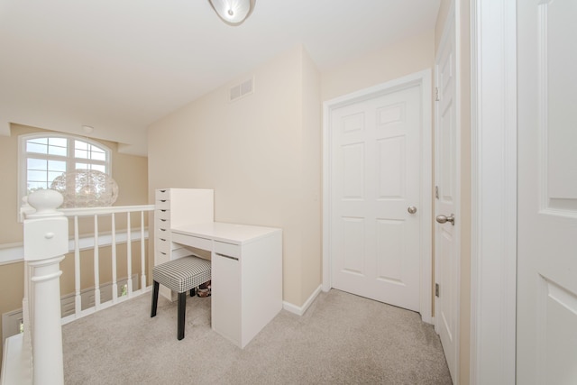 57677 Blossom Valley Trl, New Hudson, MI 48165 - corridor with light colored carpet, an upstairs landing, and baseboards