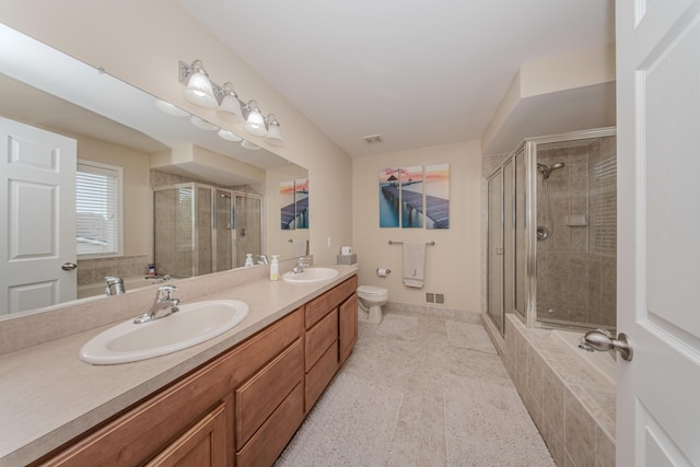 57677 Blossom Valley Trl, New Hudson, MI 48165 - full bathroom featuring a stall shower, double vanity, toilet, and tile patterned floors